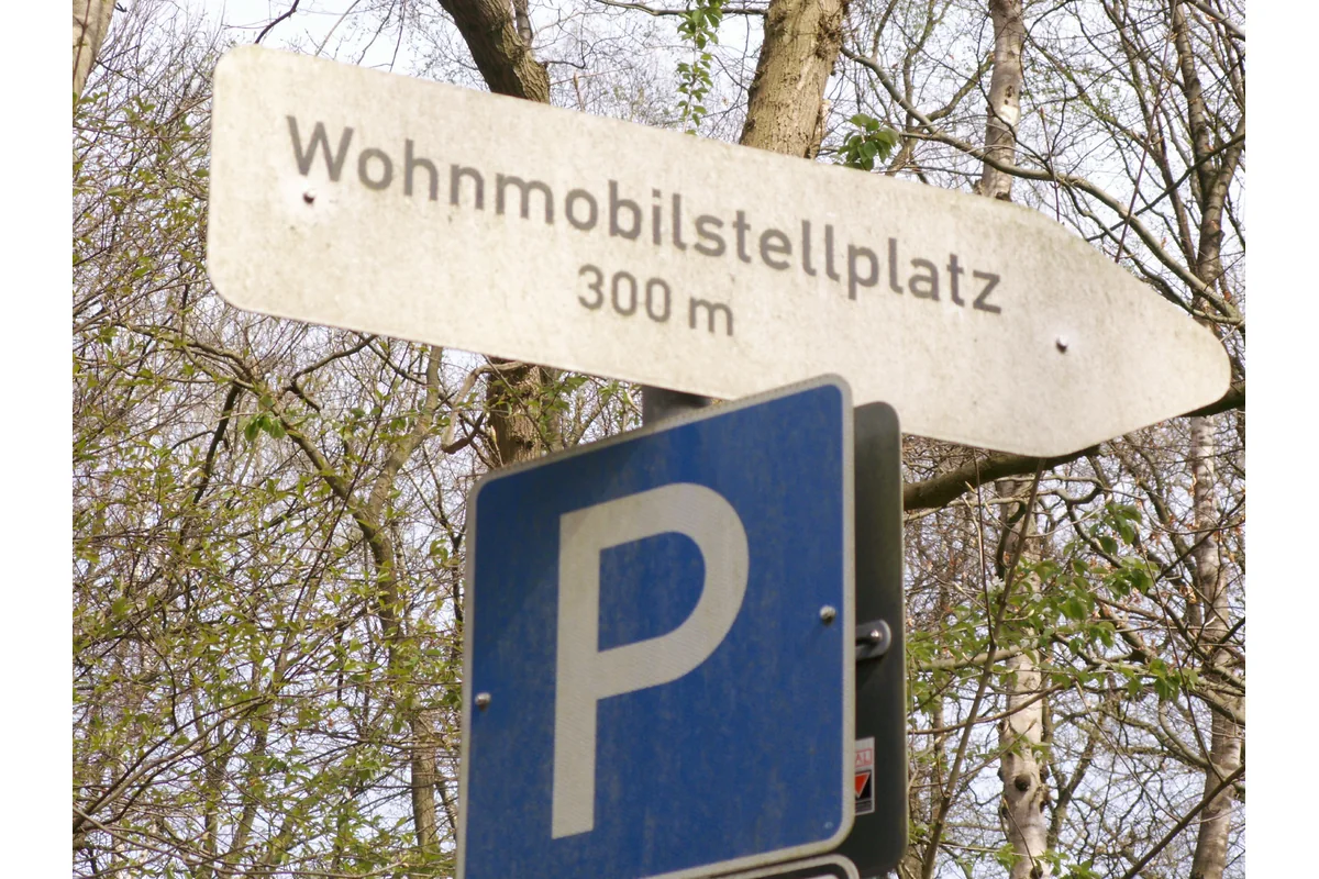 Sign pointing to a motorhome parking area