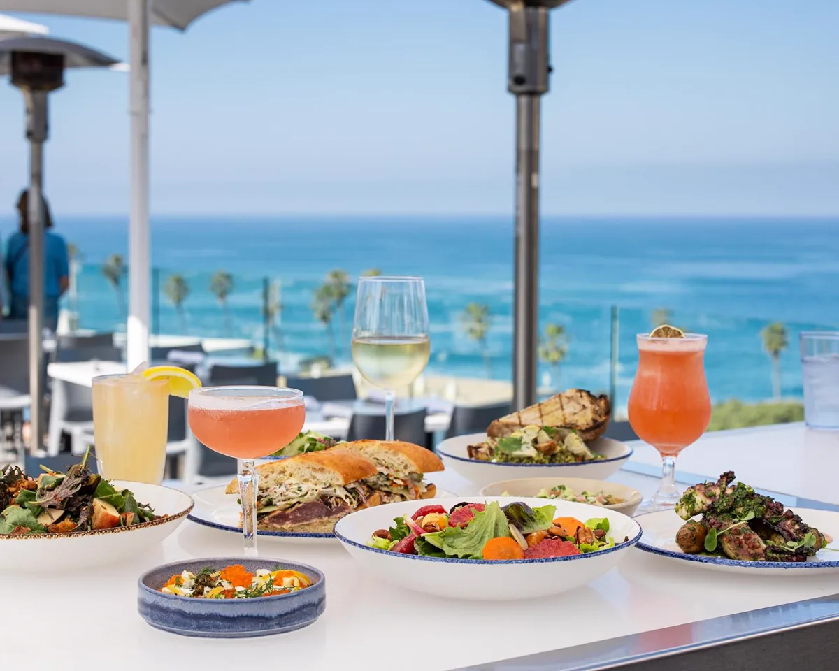 Cocktails and dishes on the Ocean Terrace at George’s at the Cove overlooking the Pacific